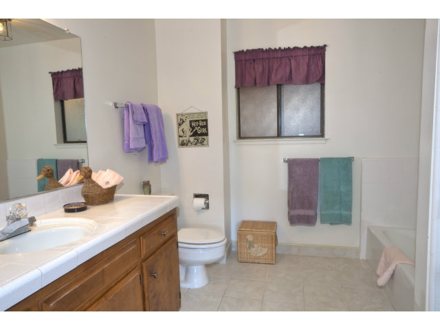 175 Ridgeway Road Hillsborough, CA 94010 - Photo 12 of 23 a bathroom with a sink vanity and mirror
