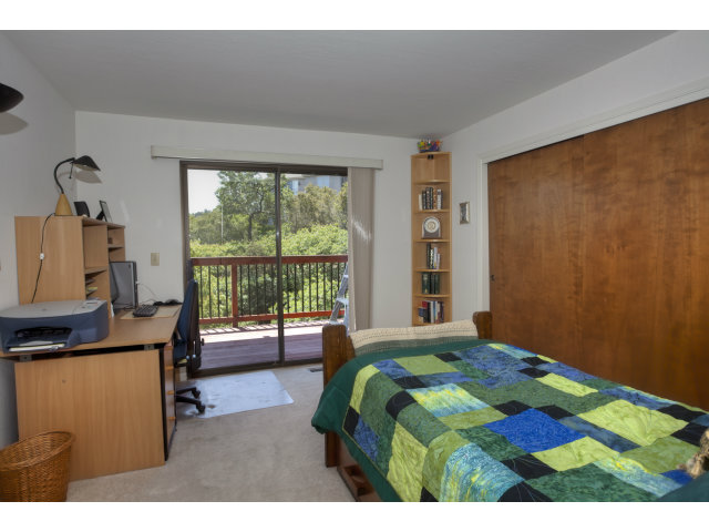 175 Ridgeway Road Hillsborough, CA 94010 - Photo 13 of 23 a bedroom with a bed and a window