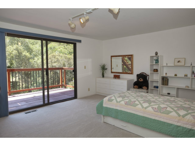 175 Ridgeway Road Hillsborough, CA 94010 - Photo 14 of 23 a bedroom with a bed and a large window