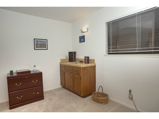 175 Ridgeway Road Hillsborough, CA 94010 - Photo 16 of 23 a room with a cabinet and mirror