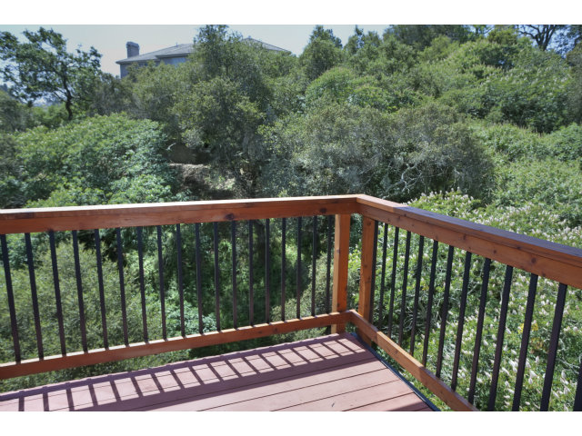 175 Ridgeway Road Hillsborough, CA 94010 - Photo 22 of 23 a view of a wooden bench in a balcony