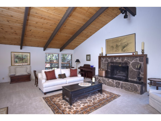 175 Ridgeway Road Hillsborough, CA 94010 - Photo 4 of 23 a living room with furniture a fireplace and a table