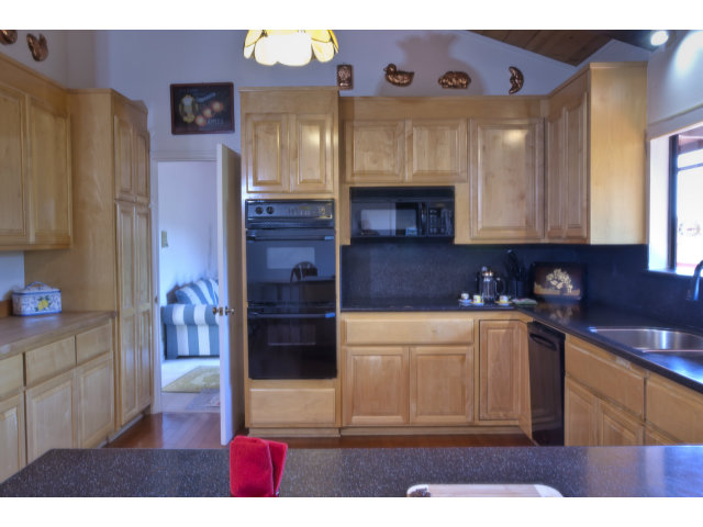 175 Ridgeway Road Hillsborough, CA 94010 - Photo 8 of 23 a kitchen with stainless steel appliances granite countertop a refrigerator and a stove