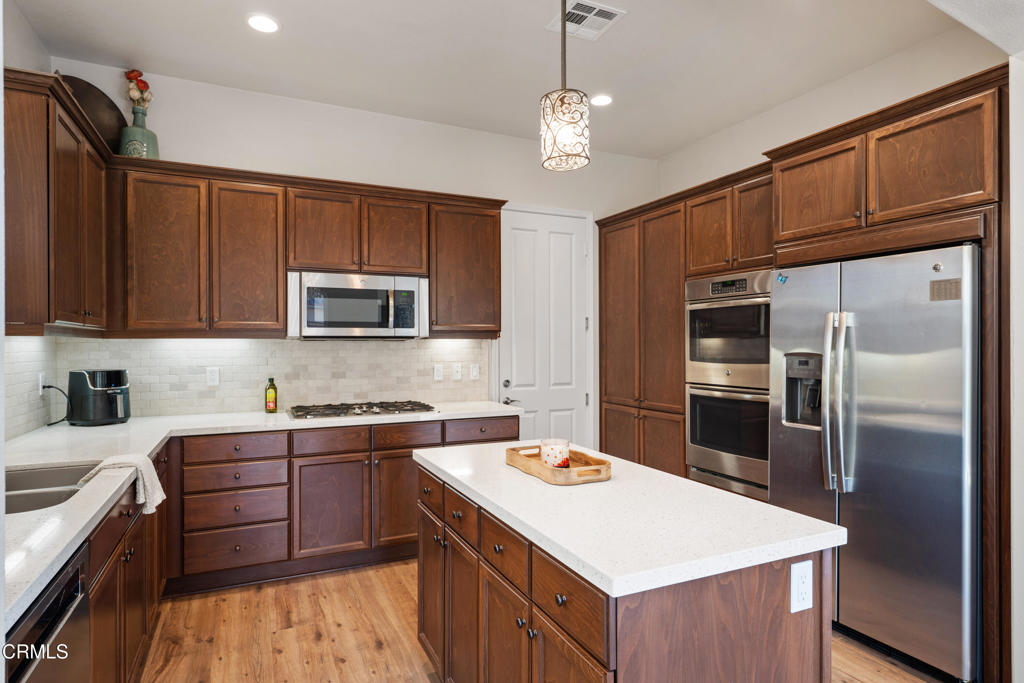 1655 Range Road Oxnard, CA 93036 - Photo 14 of 34 a kitchen that has a sink stainless steel appliances and cabinets