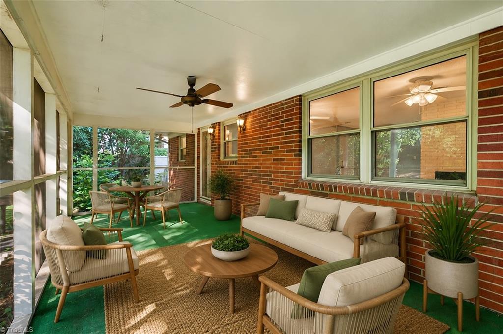 113 Green Valley Road Greensboro, NC 27403 - Photo 7 of 46 One of the home's hidden gems—a spacious screened porch where morning coffee, evening conversations, and relaxing weekends become part of everyday life. (Virtually Staged)