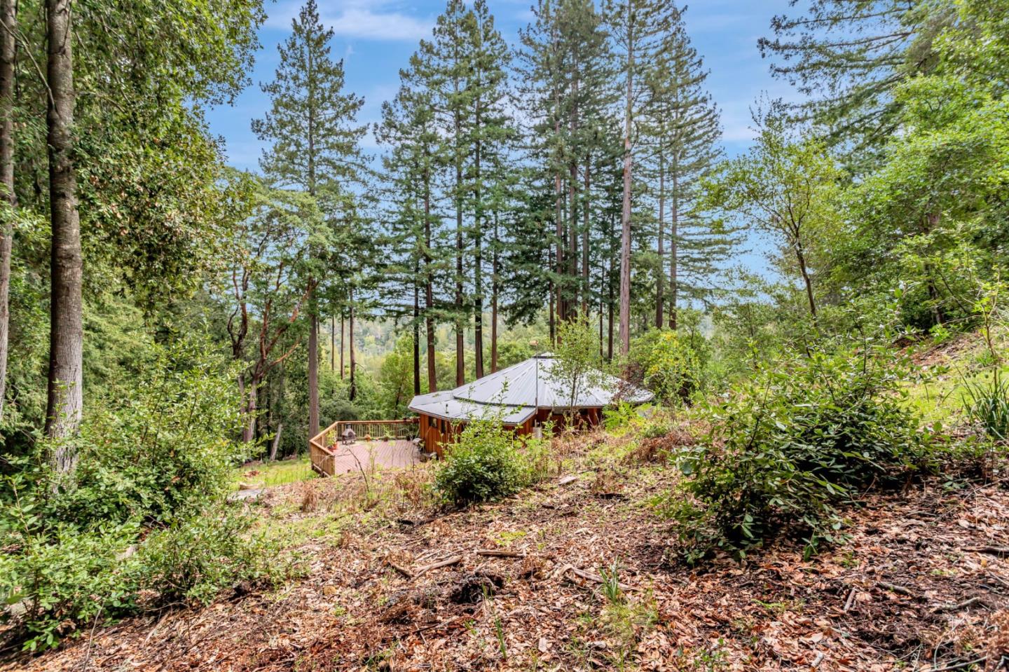 12845 Love Creek Road Ben Lomond, CA 95005 - Photo 12 of 61 a view of a garden with a table and chairs