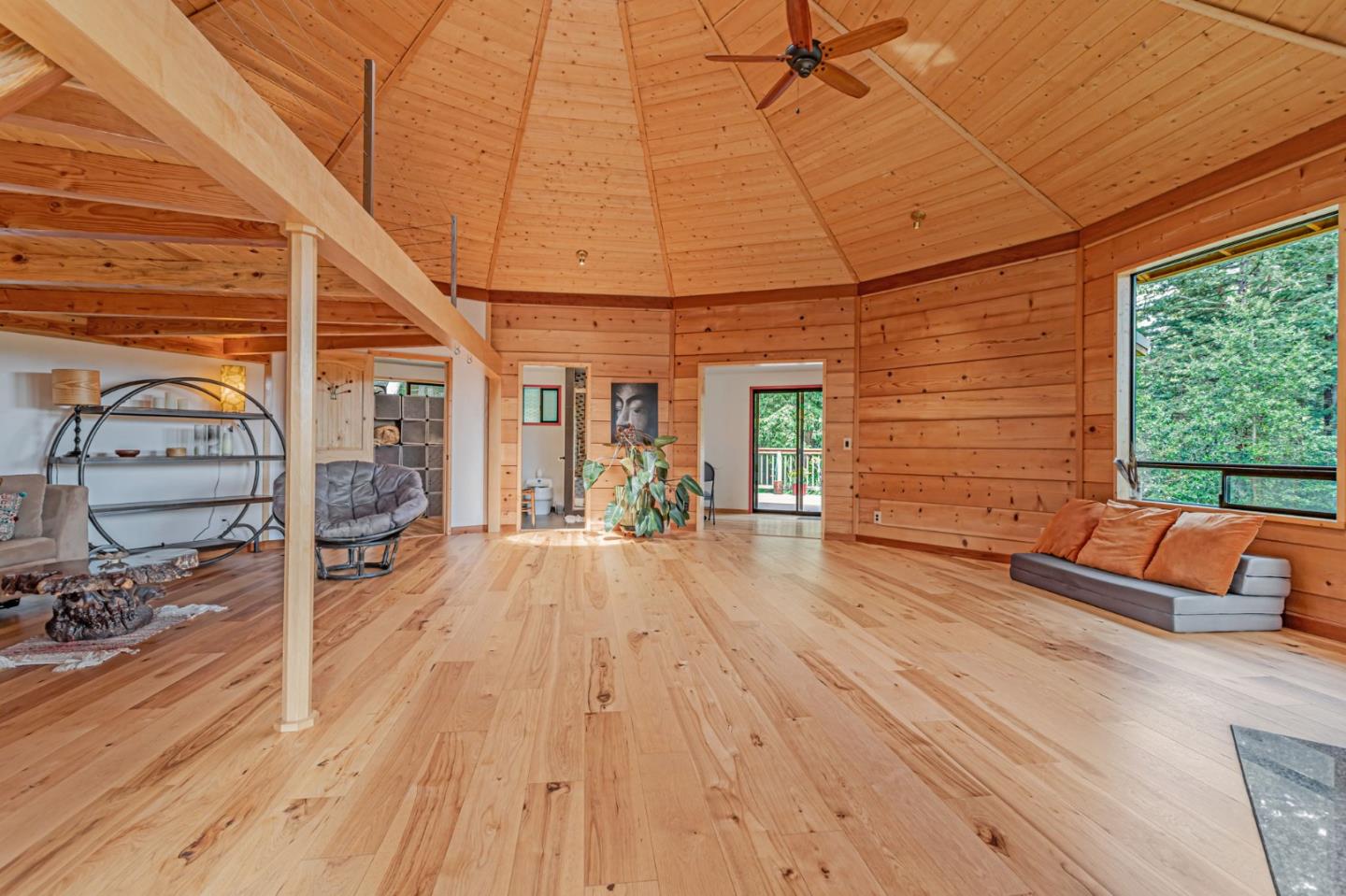 12845 Love Creek Road Ben Lomond, CA 95005 - Photo 18 of 61 a view of a patio with table and chairs under an umbrella with wooden floor