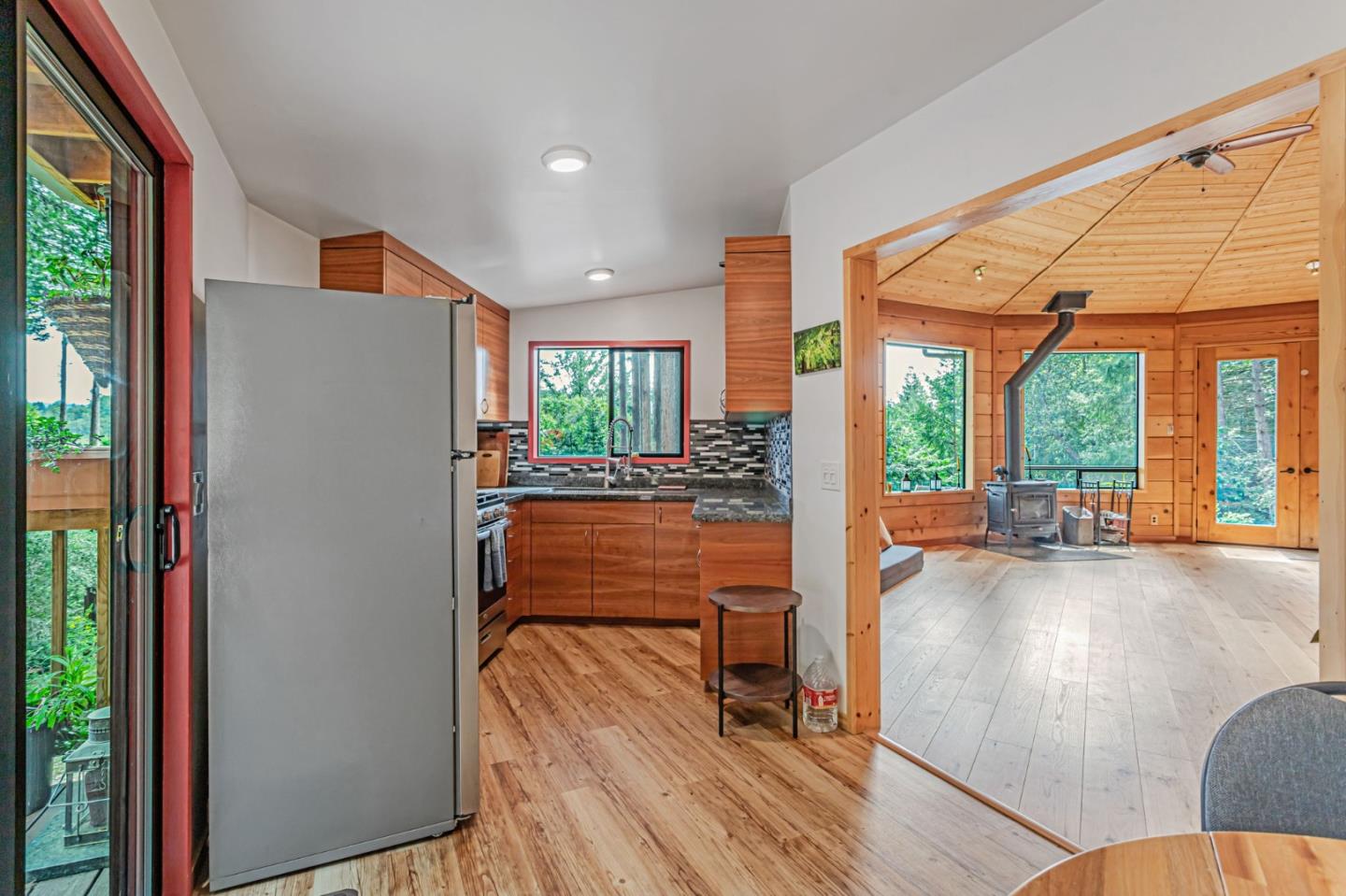 12845 Love Creek Road Ben Lomond, CA 95005 - Photo 21 of 61 a very nice looking room with large windows and wooden floor