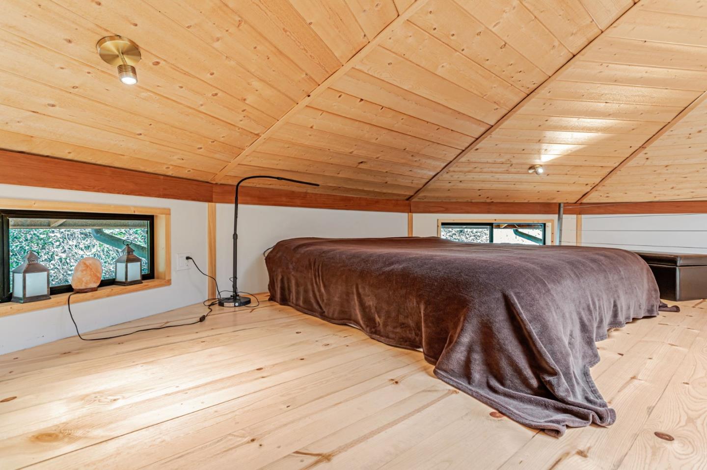 12845 Love Creek Road Ben Lomond, CA 95005 - Photo 27 of 61 a bedroom with a bed and a large window