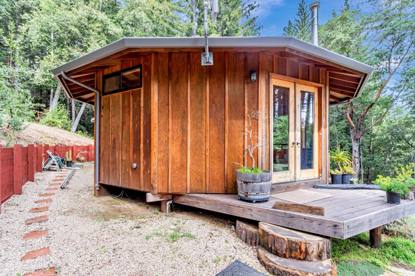 12845 Love Creek Road Ben Lomond, CA 95005 - Photo 36 of 61 a backyard of a house with barbeque oven table and chairs