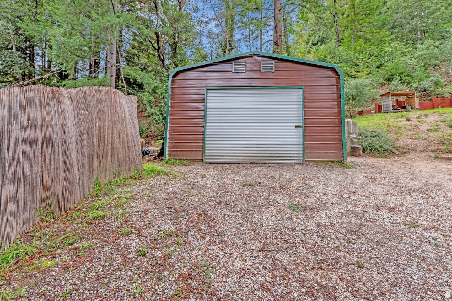 12845 Love Creek Road Ben Lomond, CA 95005 - Photo 39 of 61 a front view of a house with a yard