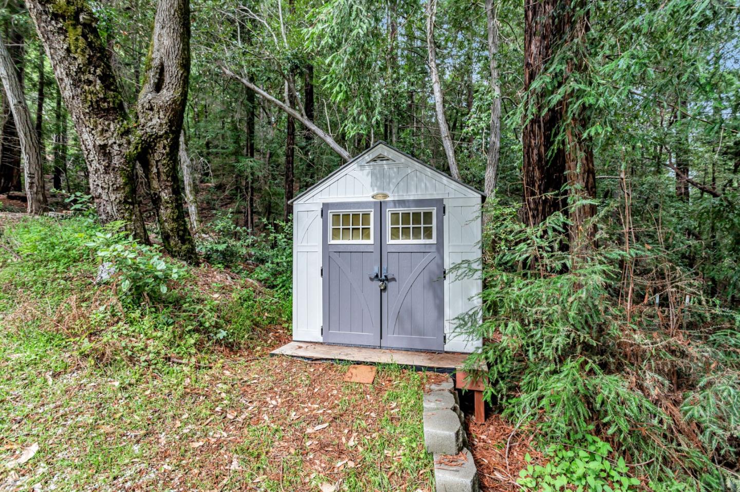 12845 Love Creek Road Ben Lomond, CA 95005 - Photo 61 of 61 a front view of a house with a yard and trees