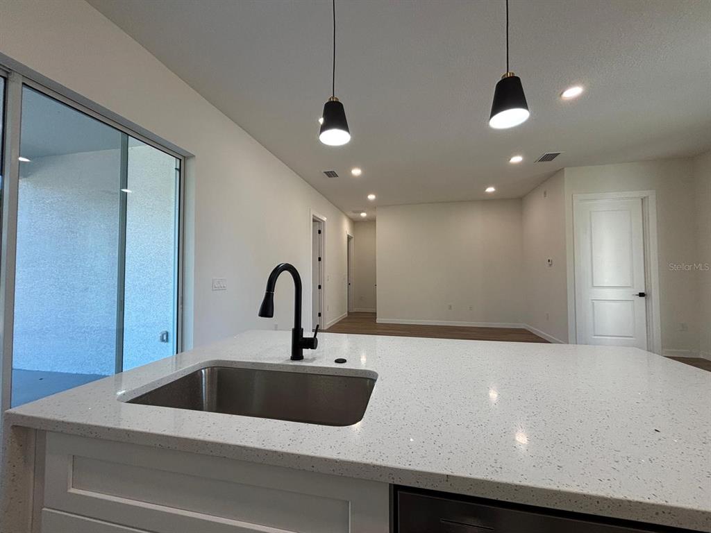 15215 Southwest 43rd Court Ocala, FL 34473 - Photo 13 of 29 a view of a kitchen with a sink and a refrigerator
