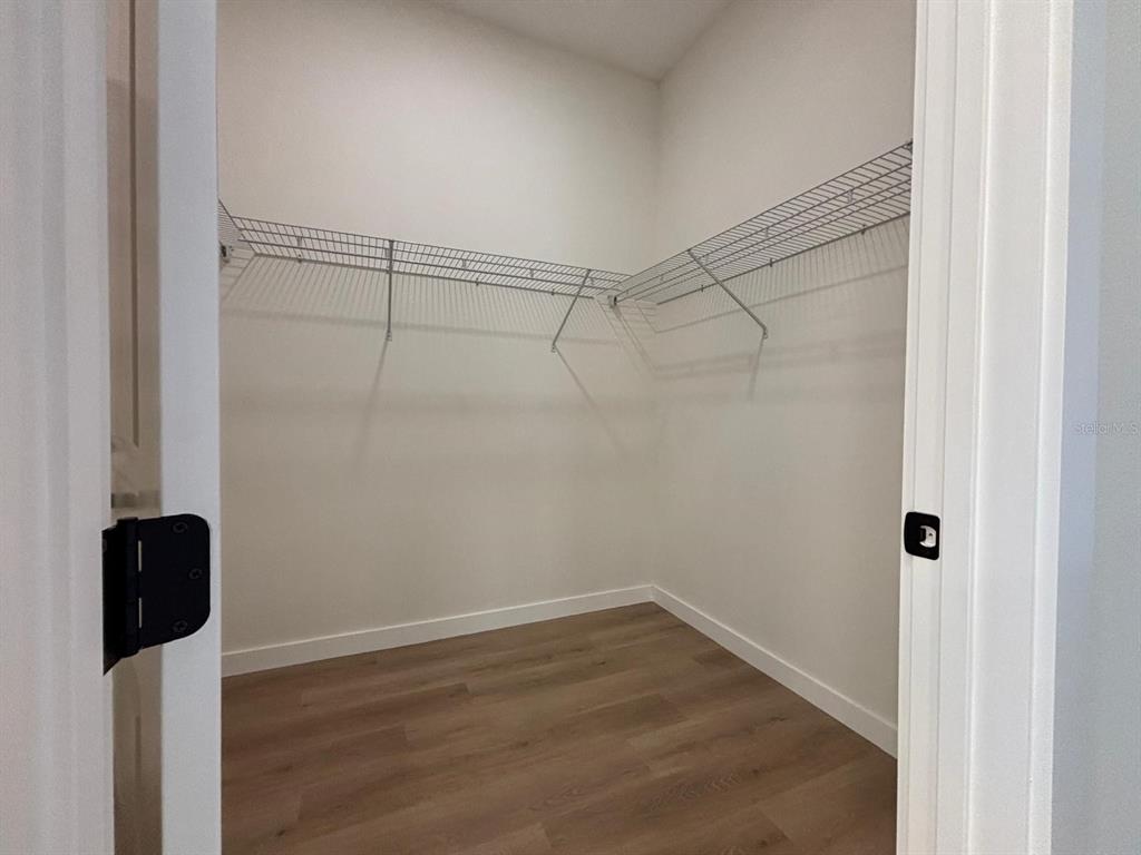 15215 Southwest 43rd Court Ocala, FL 34473 - Photo 17 of 29 a view of a room with wooden floor and cabinet