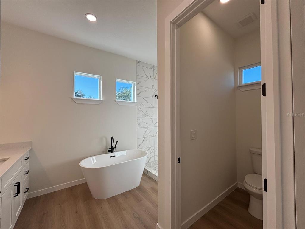 15215 Southwest 43rd Court Ocala, FL 34473 - Photo 21 of 29 a bathroom with a sink and a mirror