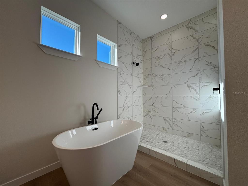 15215 Southwest 43rd Court Ocala, FL 34473 - Photo 23 of 29 a bathroom with a sink and a shower