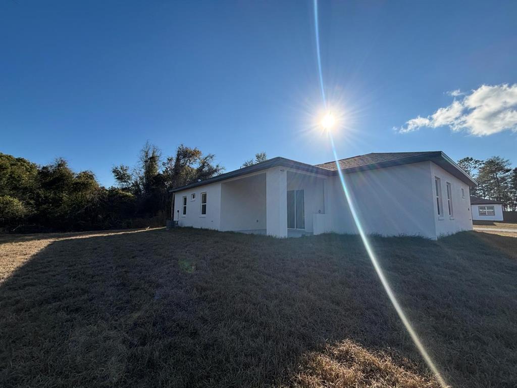 15215 Southwest 43rd Court Ocala, FL 34473 - Photo 26 of 29 a house view with a backyard space