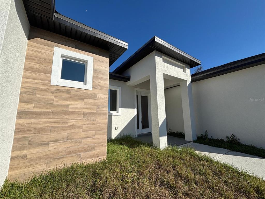 15215 Southwest 43rd Court Ocala, FL 34473 - Photo 6 of 29 a front view of a house with a yard