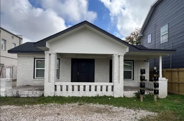 front view of a house with a yard