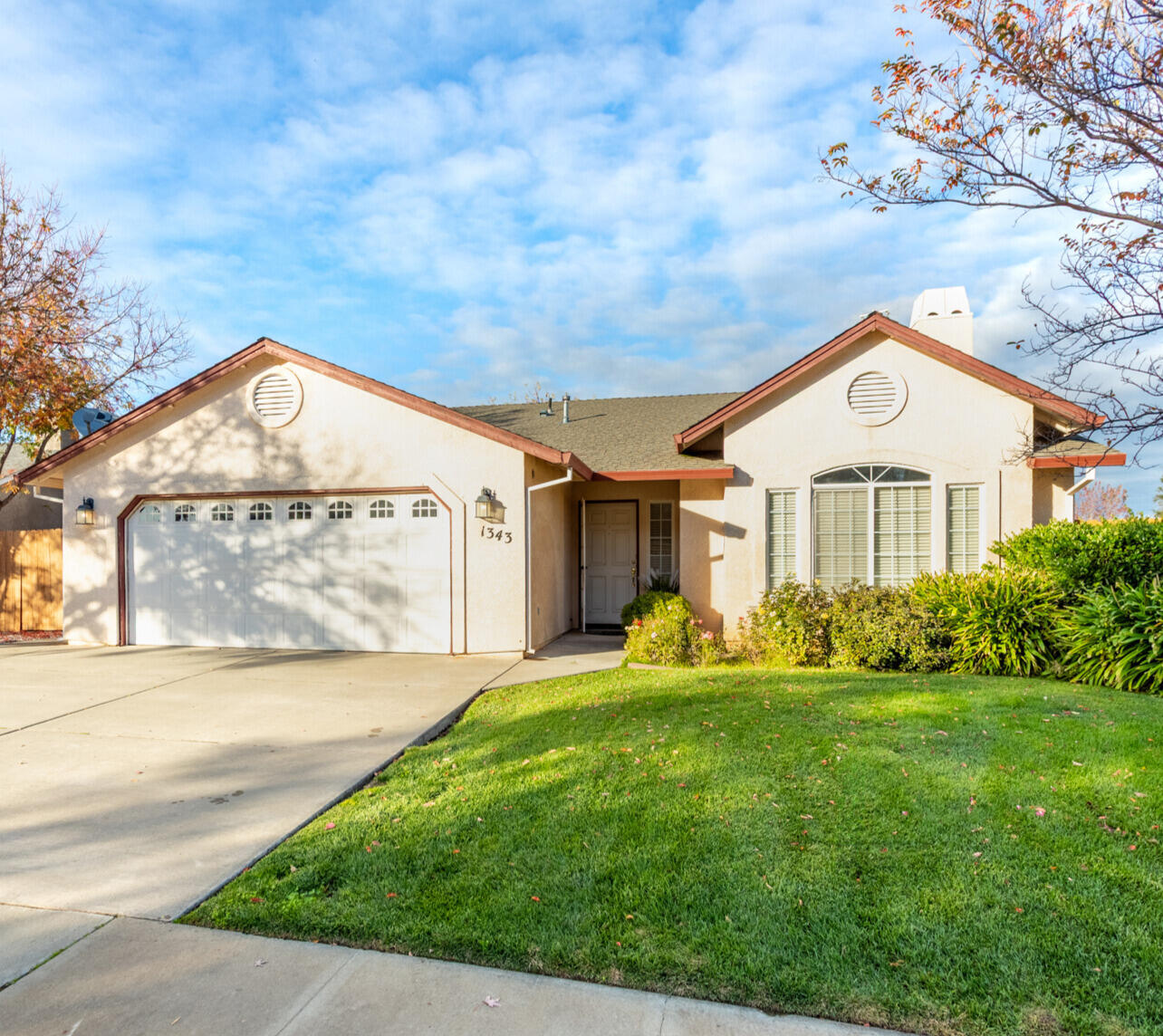 1343 Britt Lane Red Bluff, CA 96080 - Photo 1 of 17 a front view of a house with a yard and garage