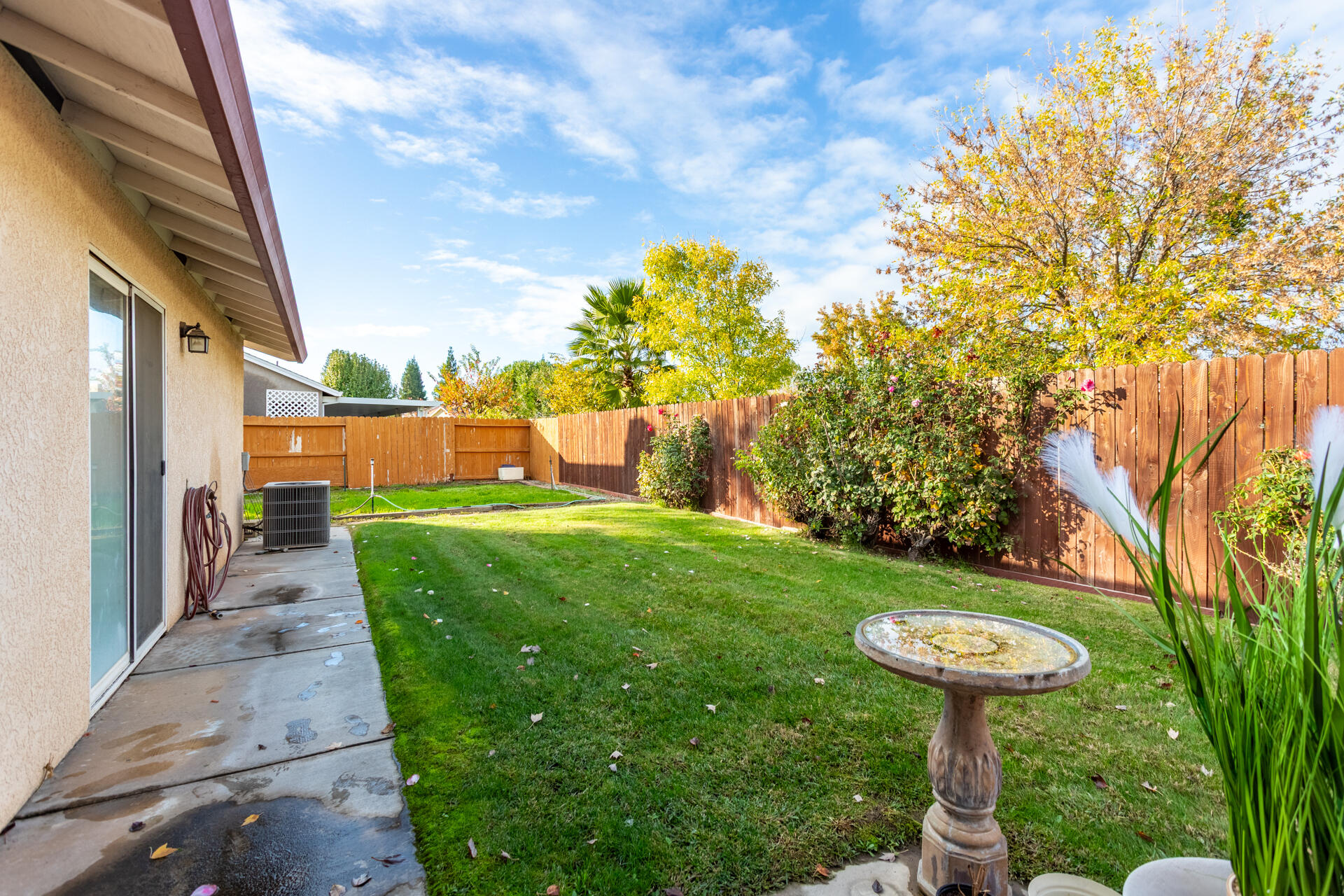 1343 Britt Lane Red Bluff, CA 96080 - Photo 15 of 17 a backyard of a house with fountain table and chairs