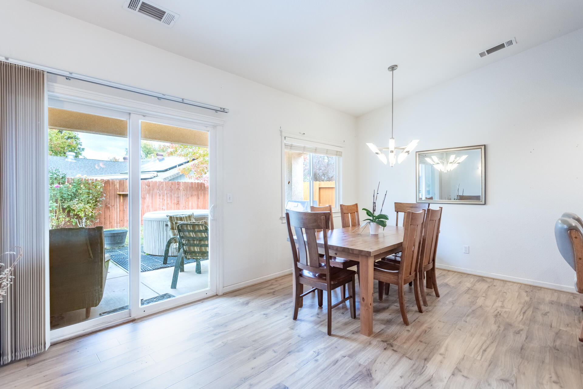 1343 Britt Lane Red Bluff, CA 96080 - Photo 4 of 17 a view of a dining room with furniture window and wooden floor