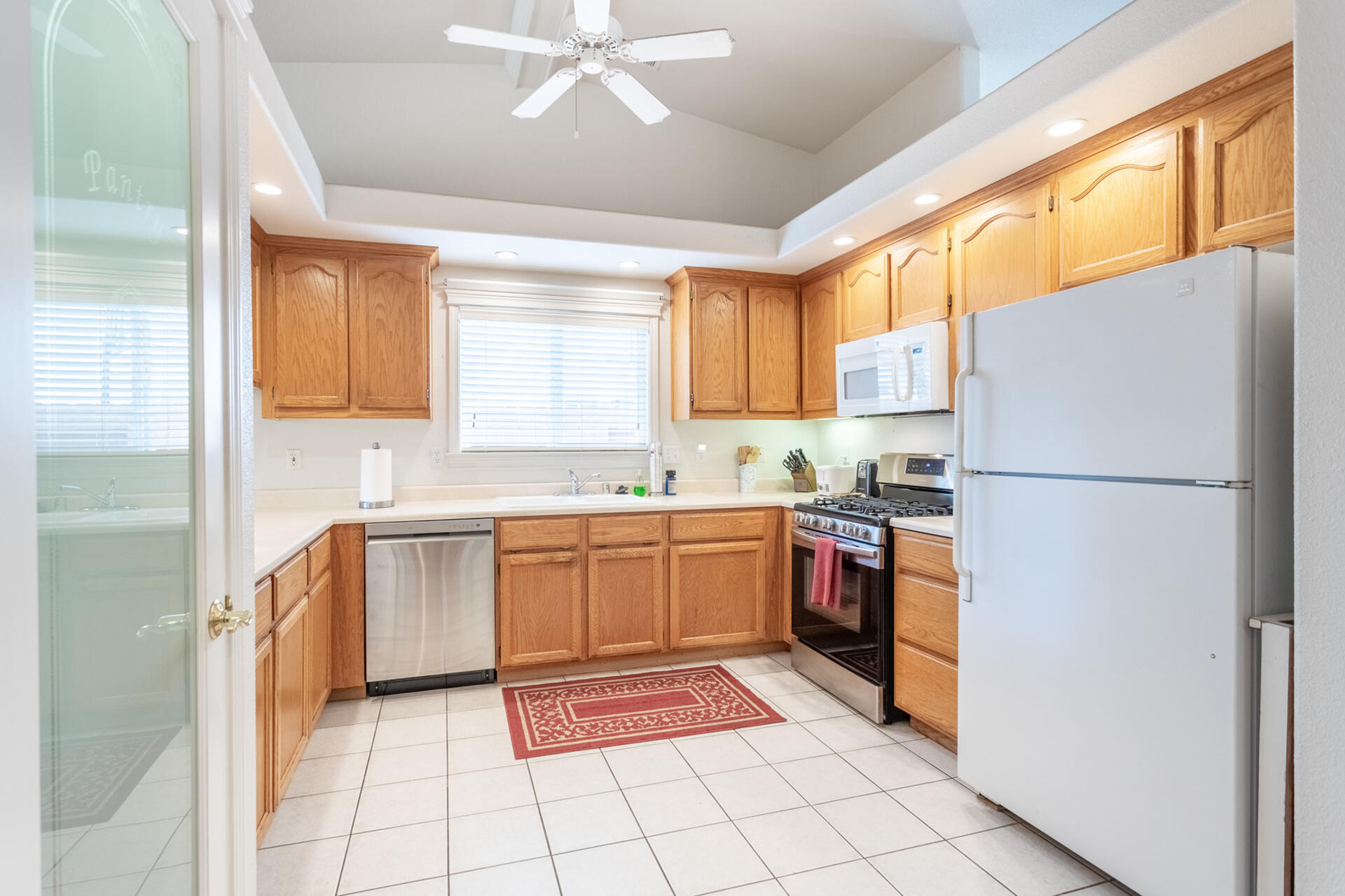 1343 Britt Lane Red Bluff, CA 96080 - Photo 6 of 17 a kitchen with stainless steel appliances granite countertop a refrigerator and a stove top oven