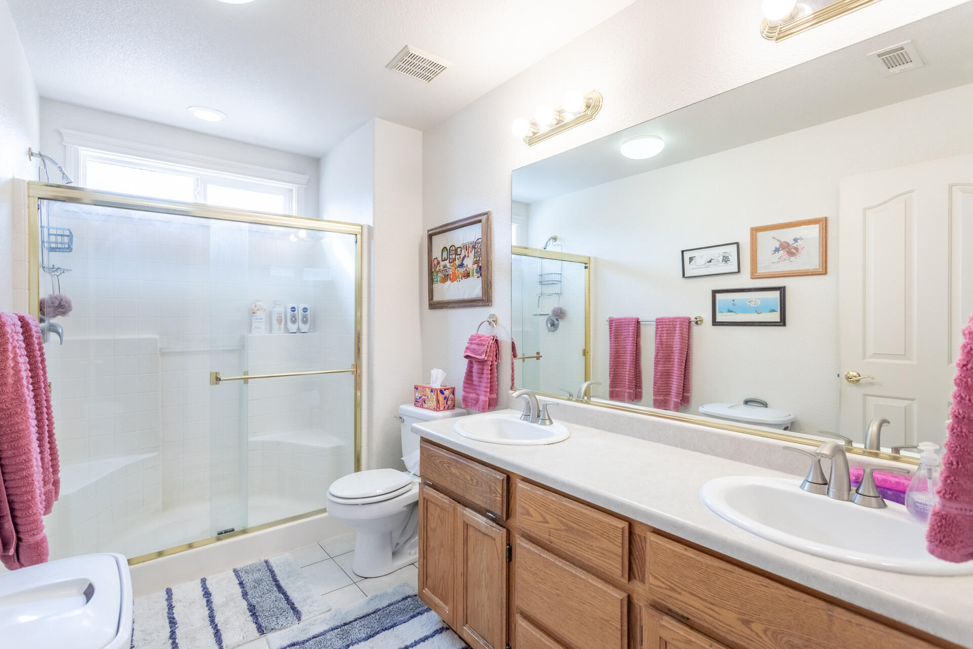 1343 Britt Lane Red Bluff, CA 96080 - Photo 9 of 17 a bathroom with a sink vanity toilet and shower