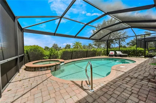 a view of a swimming pool with a patio