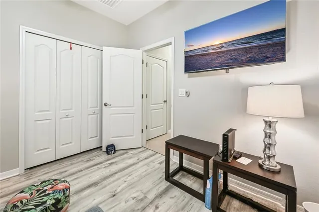 a view of a workspace with furniture and wooden floor