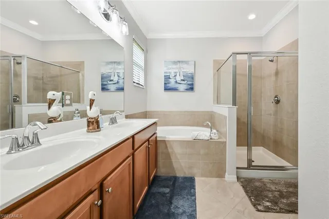 a bathroom with a double vanity sink mirror and shower