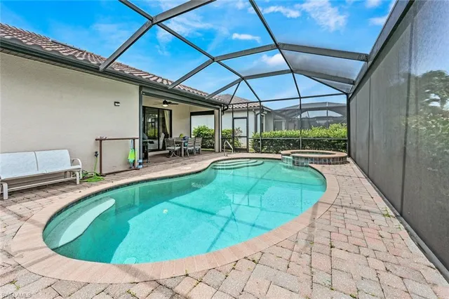 a view of a swimming pool with a patio