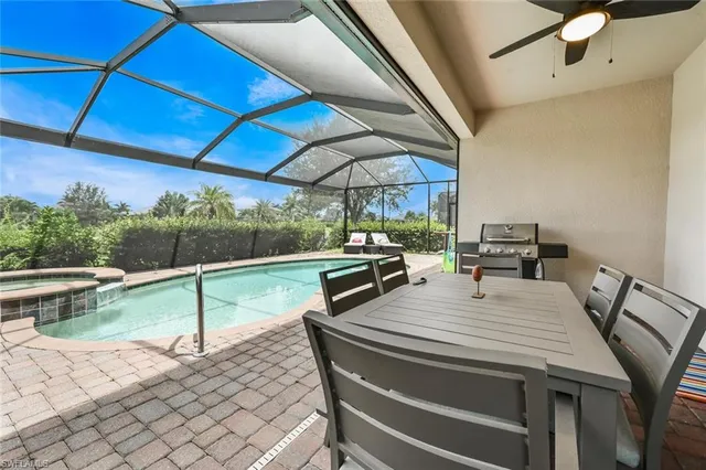 a view of a patio with a table and chairs