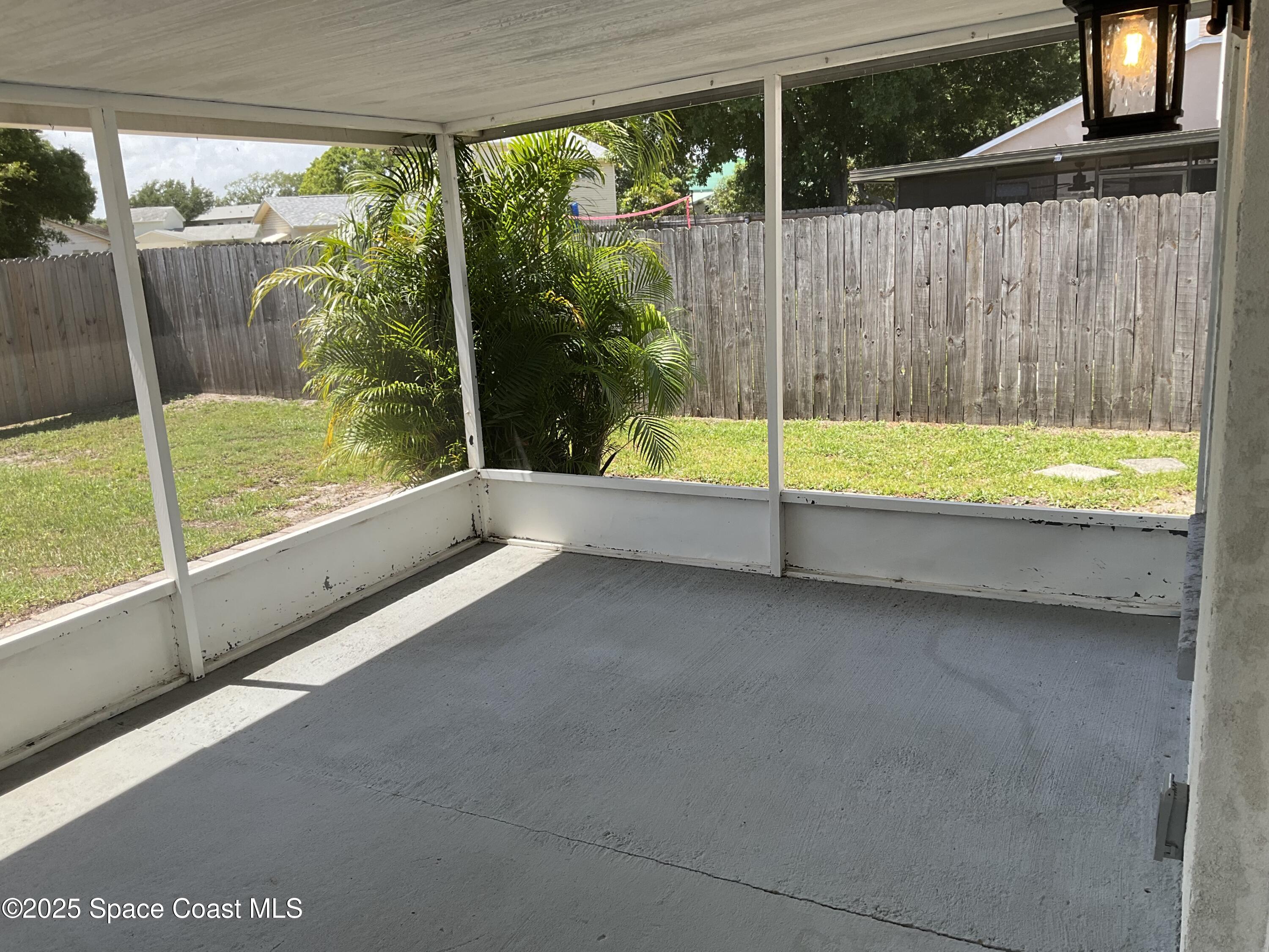 1668 Clover Circle Melbourne, FL 32935 - Photo 15 of 16 a view of outdoor space with swimming pool