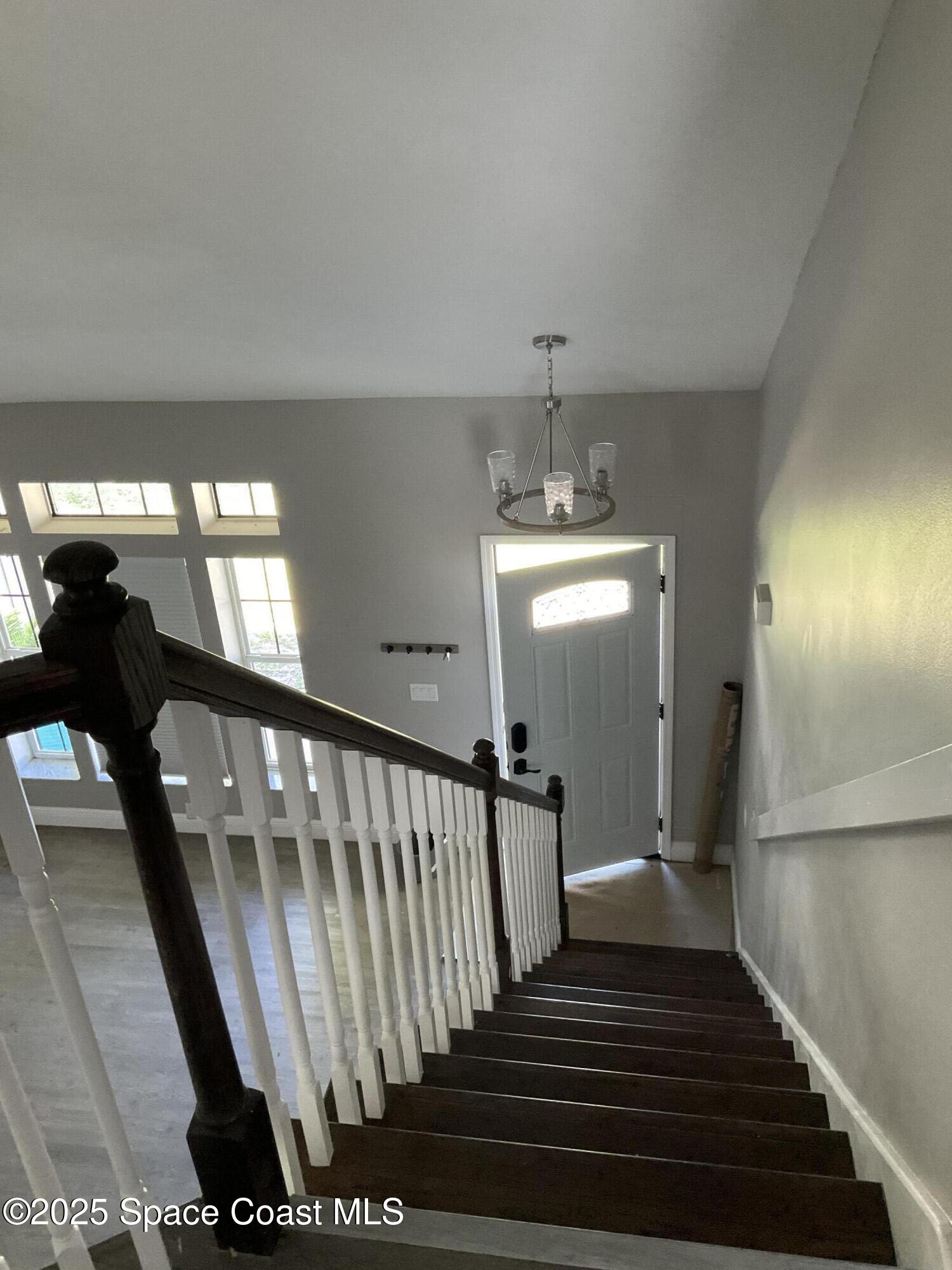 1668 Clover Circle Melbourne, FL 32935 - Photo 5 of 16 a view of entryway and hall with wooden floor