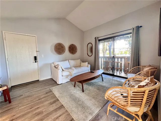 a bedroom with a bed and a chair