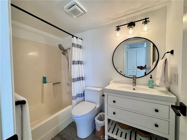 a kitchen with granite countertop kitchen island stainless steel appliances a table and chairs in it