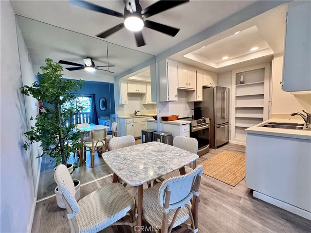 a kitchen with a sink cabinets and stainless steel appliances