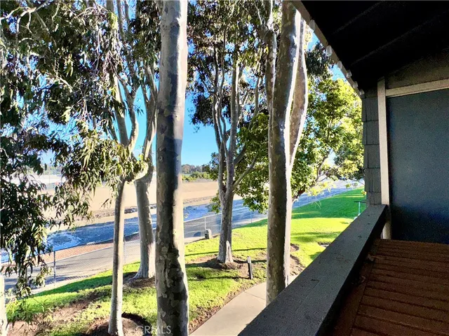 a view of a chairs and table in a balcony