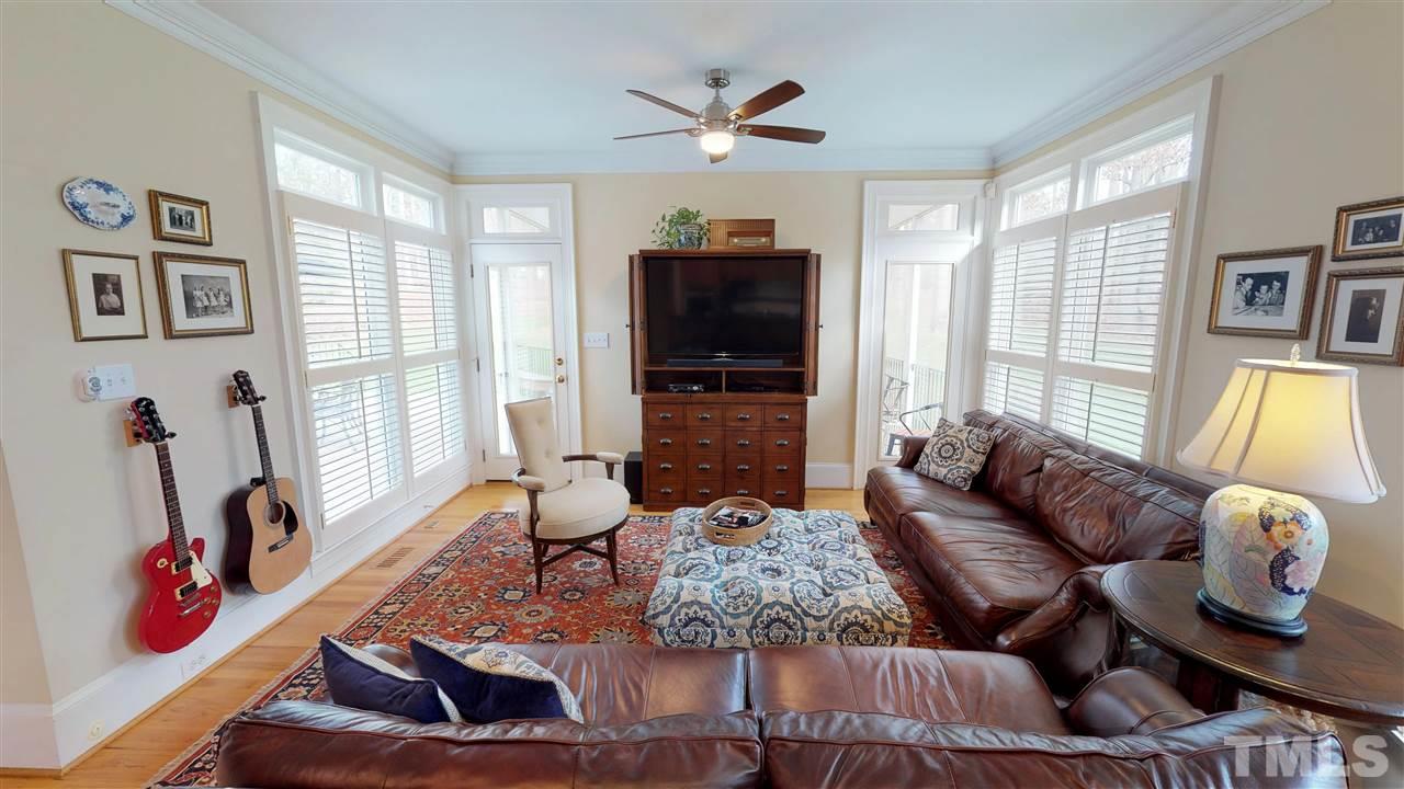 11208 Brass Kettle Road Raleigh, NC 27614 - Photo 11 of 25 a living room with furniture and flat screen tv