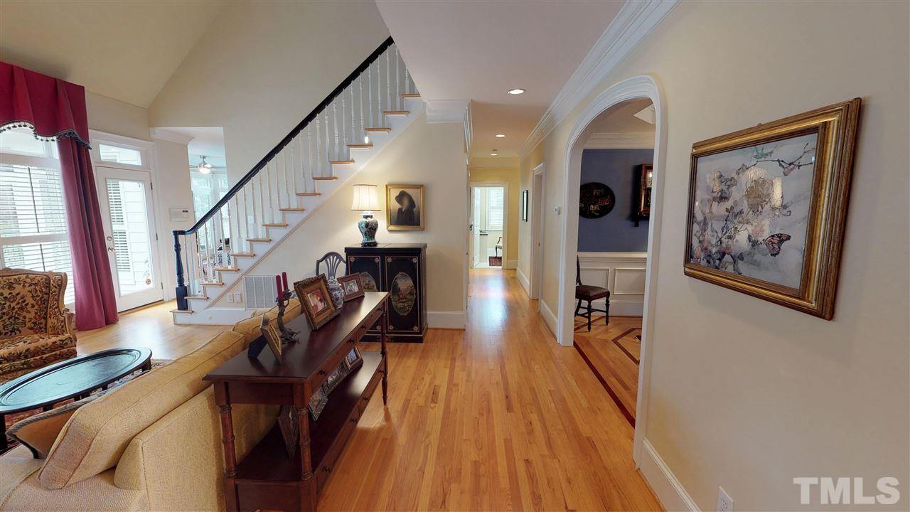 11208 Brass Kettle Road Raleigh, NC 27614 - Photo 12 of 25 a view of a hallway with wooden floor and stairs