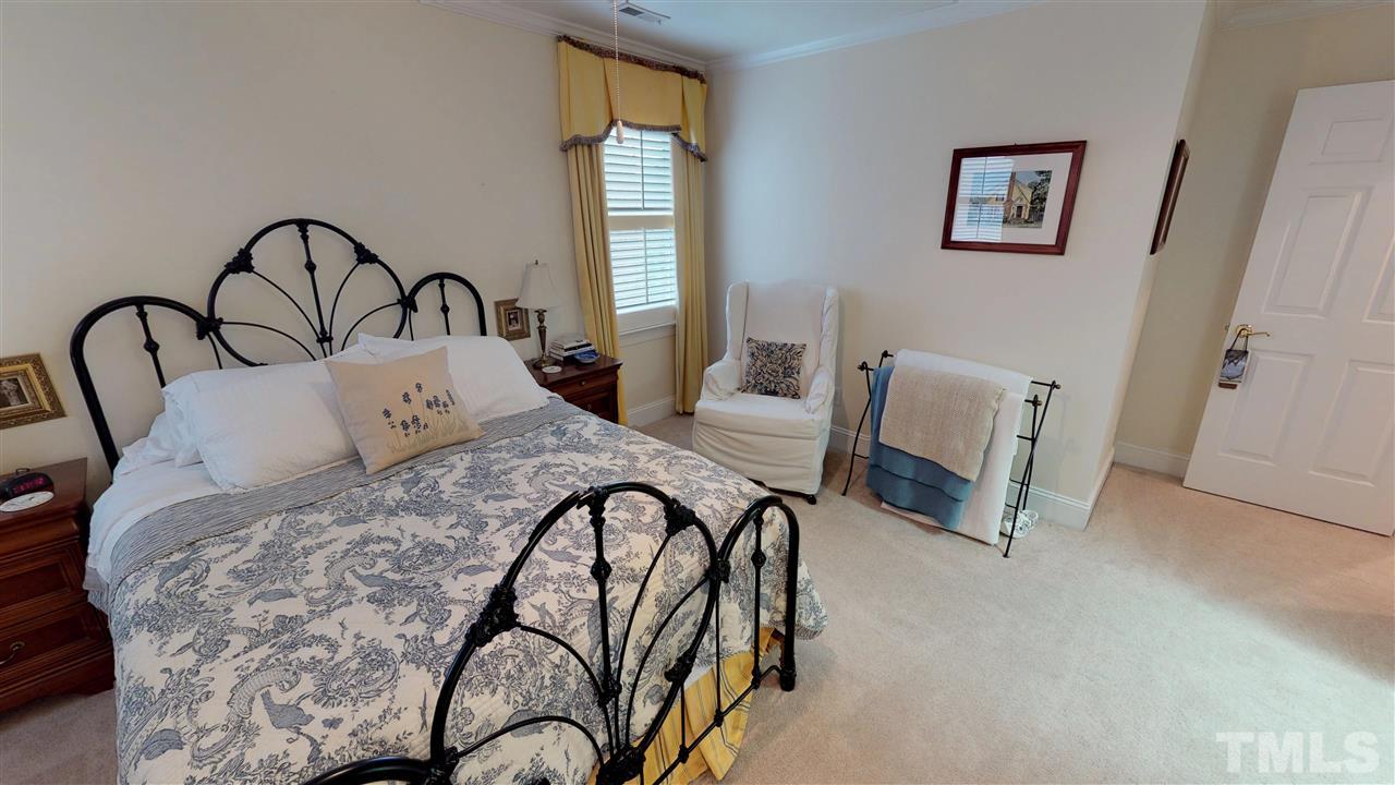 11208 Brass Kettle Road Raleigh, NC 27614 - Photo 17 of 25 a bedroom with furniture and a window