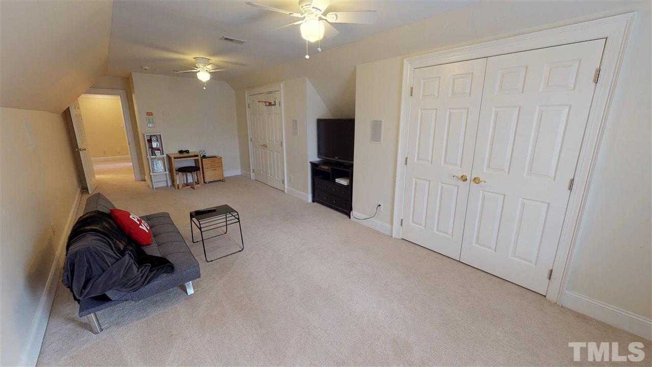 11208 Brass Kettle Road Raleigh, NC 27614 - Photo 21 of 25 a view of a livingroom with furniture and a chandelier