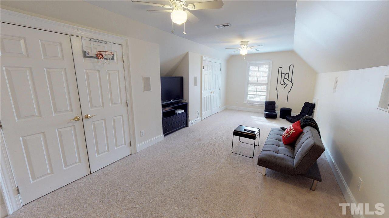 11208 Brass Kettle Road Raleigh, NC 27614 - Photo 22 of 25 a living room with furniture and a flat screen tv