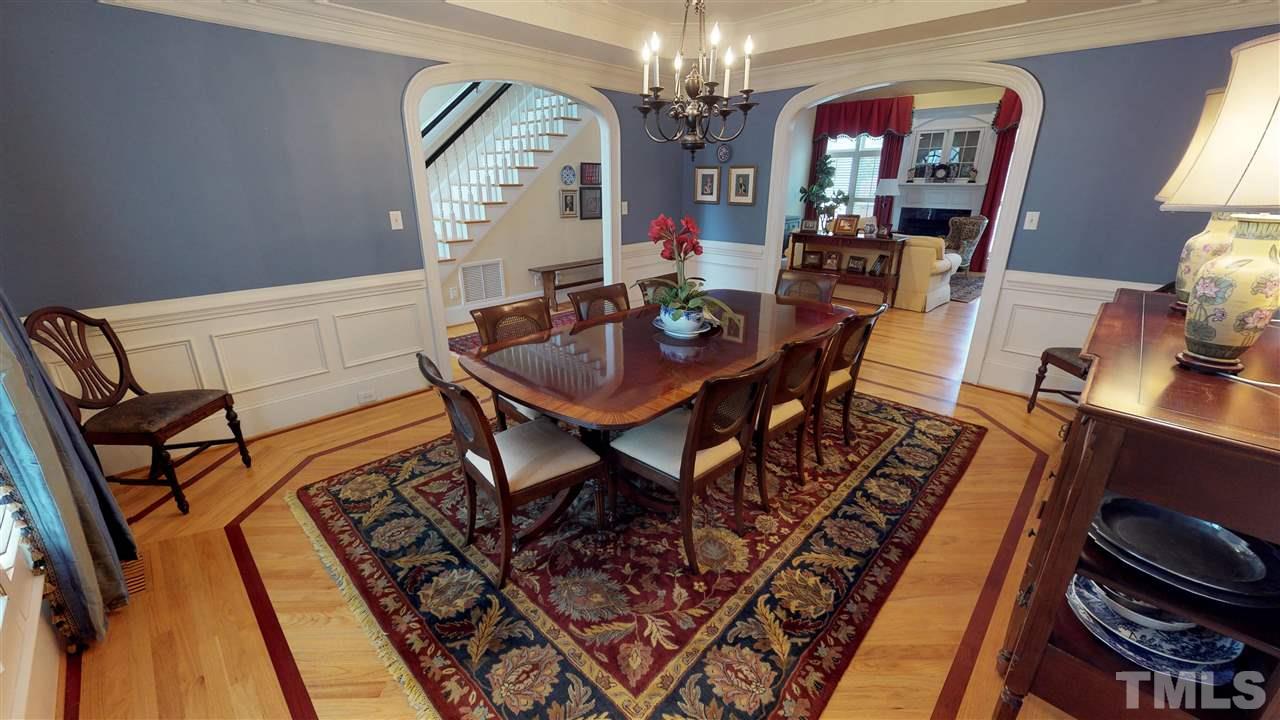 11208 Brass Kettle Road Raleigh, NC 27614 - Photo 4 of 25 a view of a dining room with furniture and a chandelier
