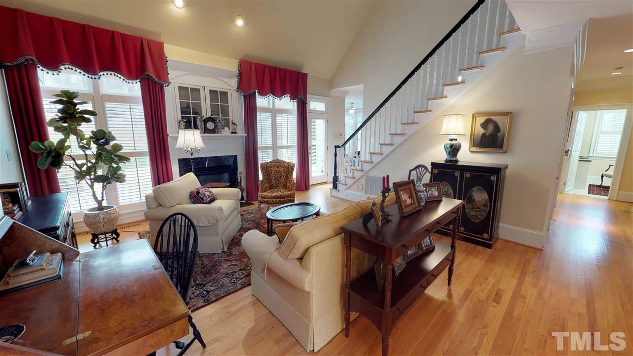 11208 Brass Kettle Road Raleigh, NC 27614 - Photo 6 of 25 a living room with furniture fireplace and wooden floor