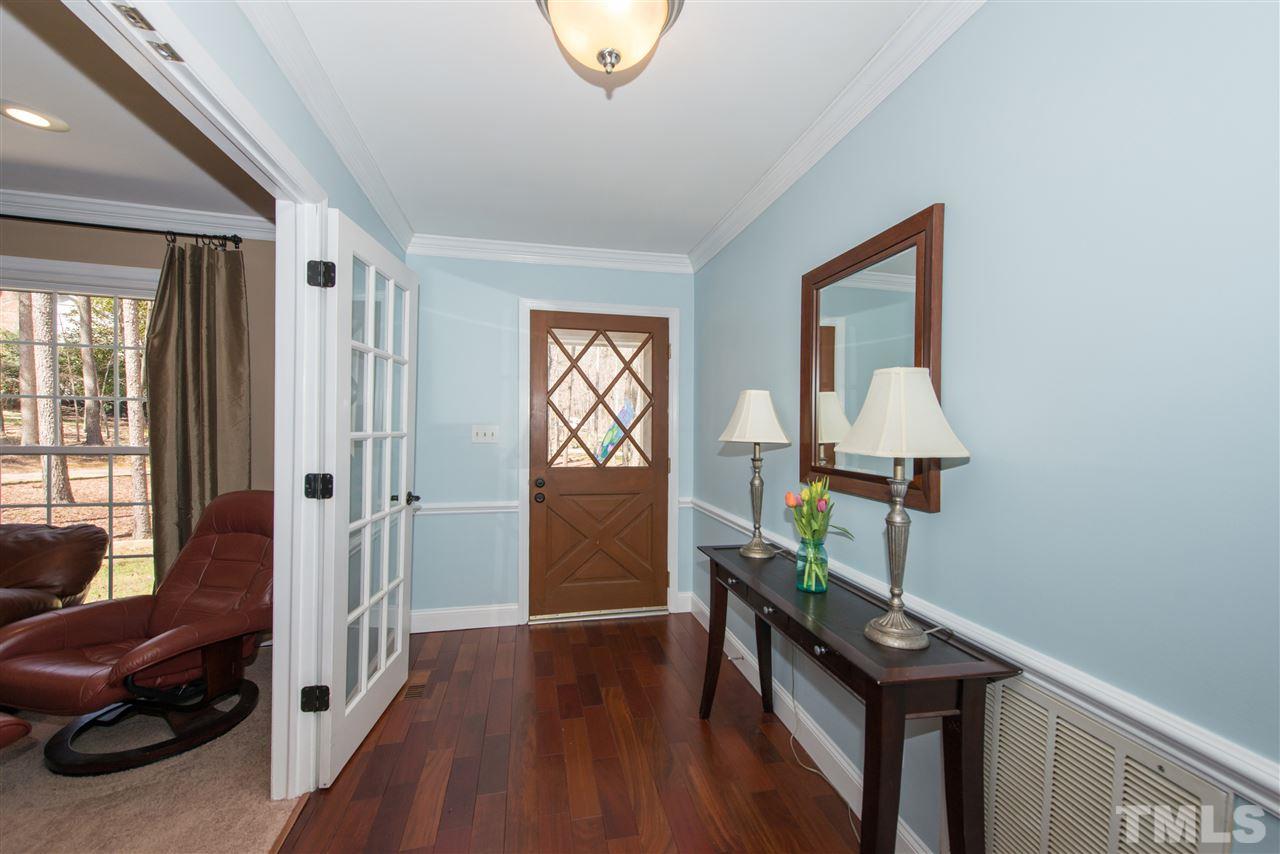 10000 Bavin Place Raleigh, NC 27613 - Photo 2 of 23 a living room with furniture and a wooden floor