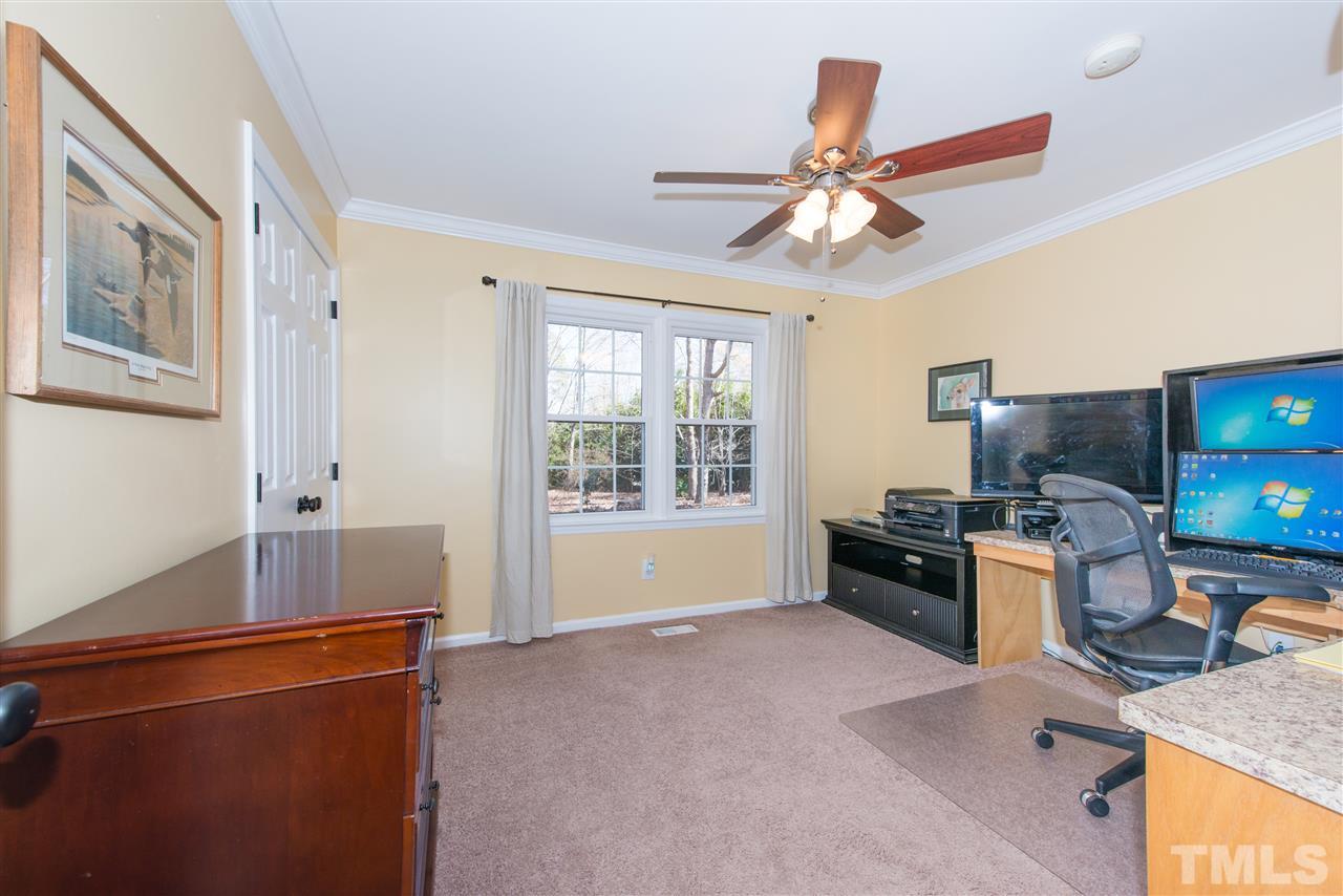10000 Bavin Place Raleigh, NC 27613 - Photo 12 of 23 a living room with furniture and a flat screen tv