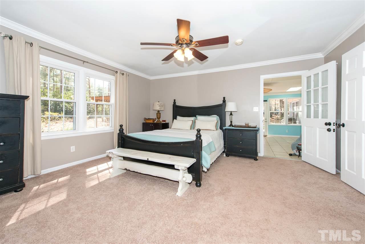 10000 Bavin Place Raleigh, NC 27613 - Photo 15 of 23 a bedroom with a bed and window