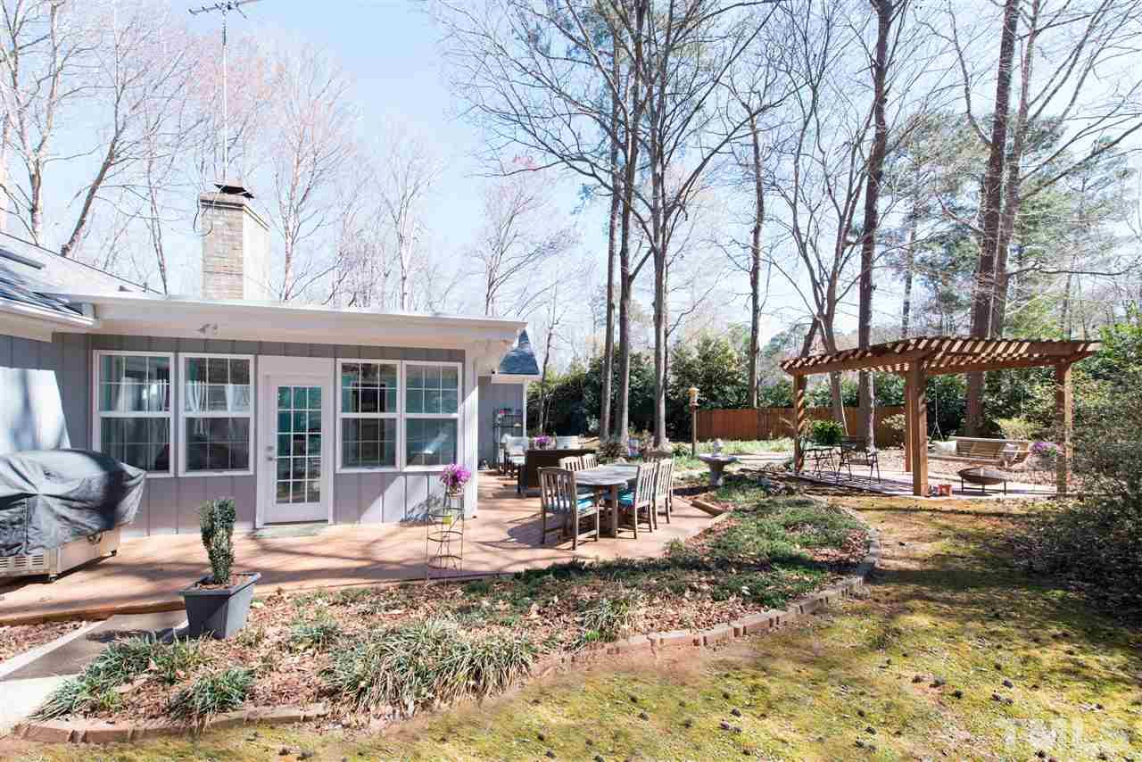 10000 Bavin Place Raleigh, NC 27613 - Photo 19 of 23 a view of a house with backyard stove and sitting area